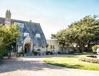 Front of Florence House Seaford. Shows the drive and front entrance. The sky is pale blue and the trees are casting long shadows
