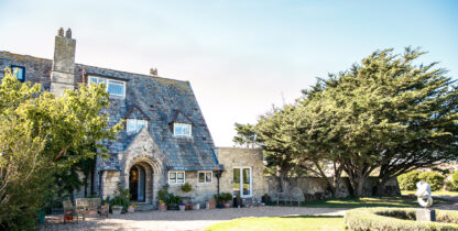 Front of Florence House Seaford. Shows the drive and front entrance. The sky is pale blue and the trees are casting long shadows